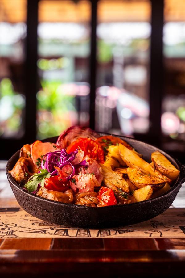 Stew in a cast iron skillet with Spanish potatoes