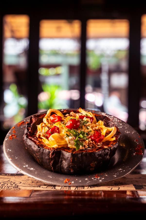 Pasta served in a roasted squash