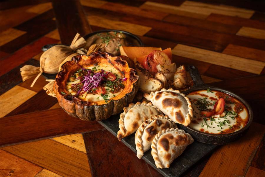 A board of empanadas and stews to share